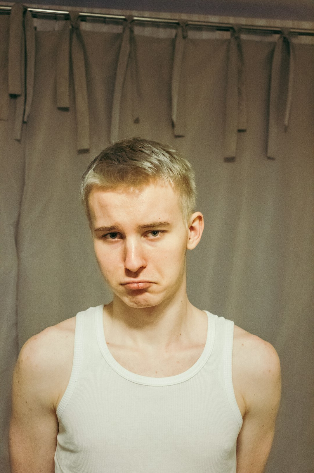 Studio portrait of a young man with short hair