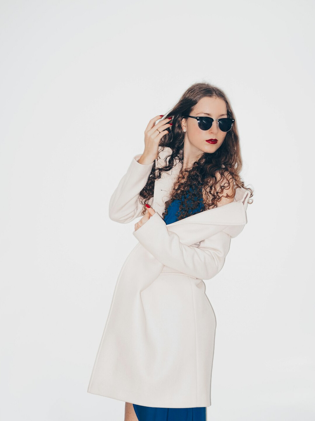 Studio portrait of a young businesswoman with curly hair